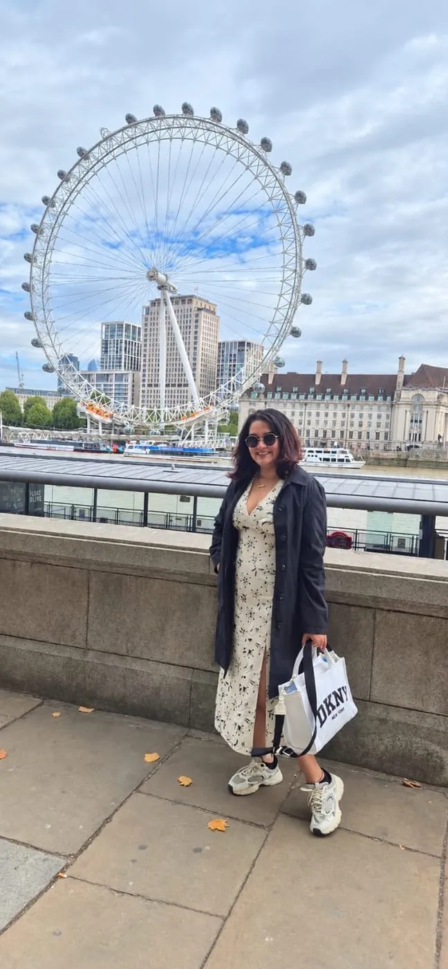 Bhagyashri on the South Bank with the London Eye behind her